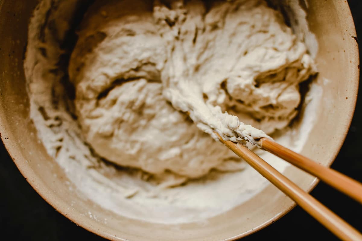 Shaggy flour-and-water dough resting in a bowl at the autolyse stage