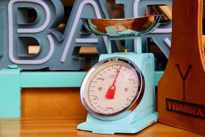 A vintage kitchen scale used for weighing ingredients
