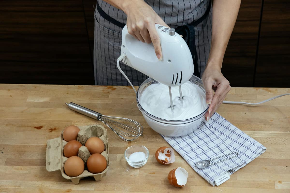 Egg yolks whipping to a pale, airy foam